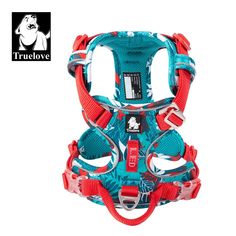 Colorful dog harness with floral pattern on a white background, featuring the Truelove brand.