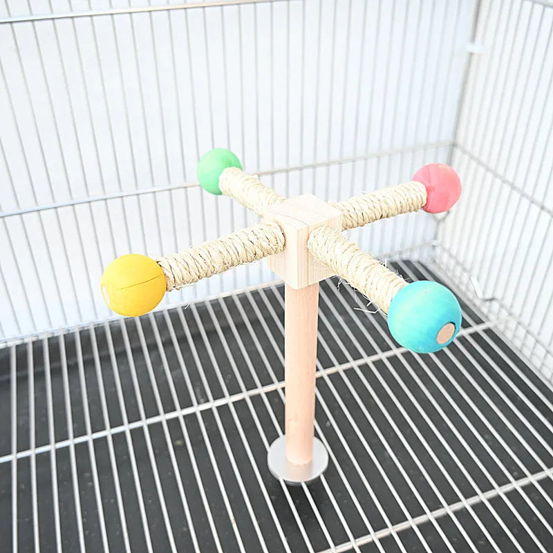 Colorful bird toy stand inside a birdcage with variously colored beads.