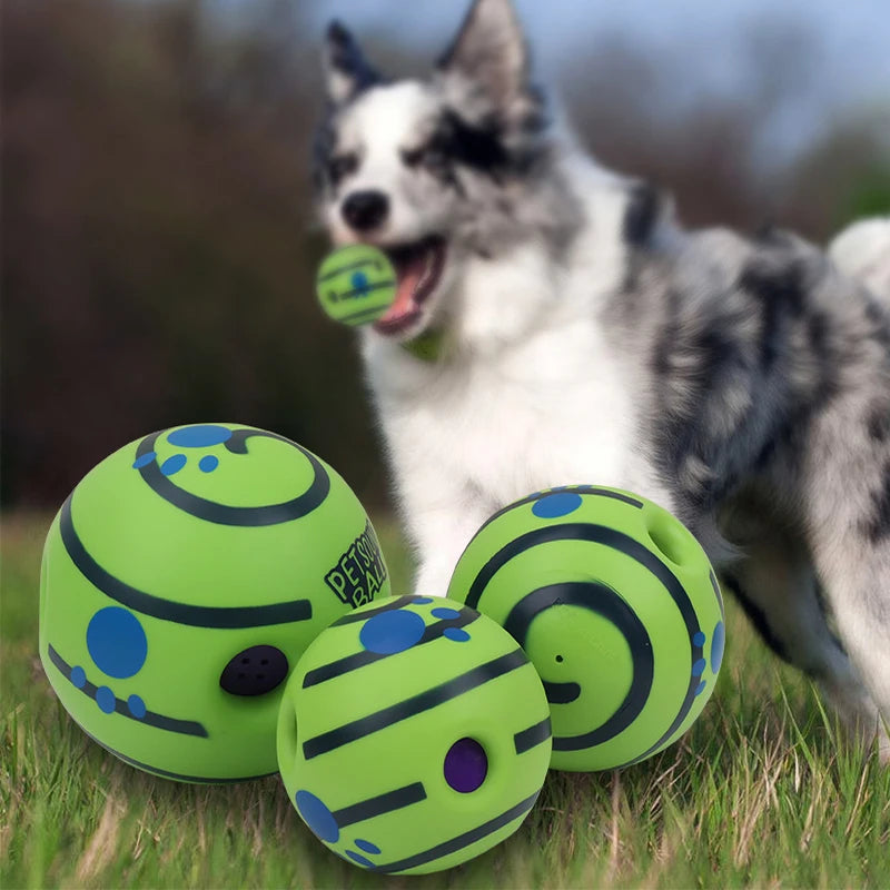 Three green dog toys with black and blue patterns on a grassy field, with a dog in the background.