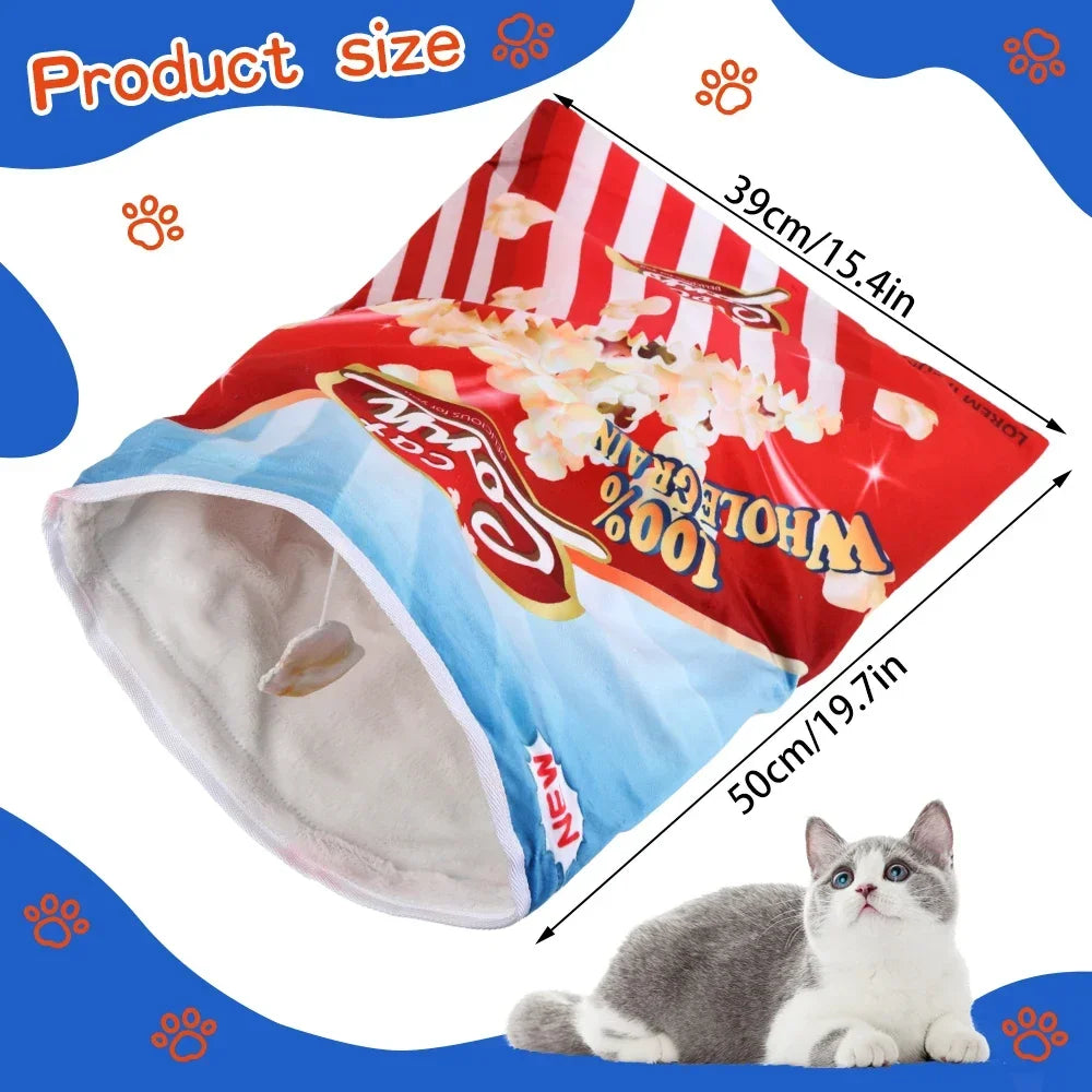 Cat bed designed like a movie theater popcorn bag with measurements and a cat sitting next to it.
