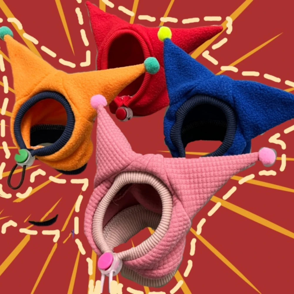 Four colorful cat-shaped headbands in orange, red, blue, and pink on a red background with yellow lines.