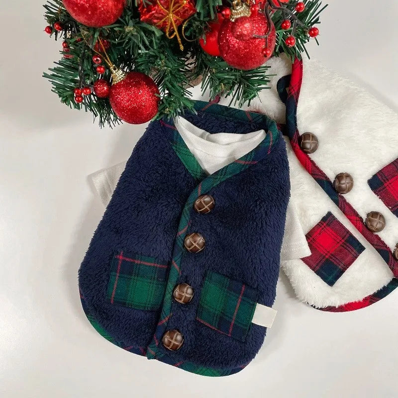 Christmas-themed dog sweater with plaid details and a wreath in the background