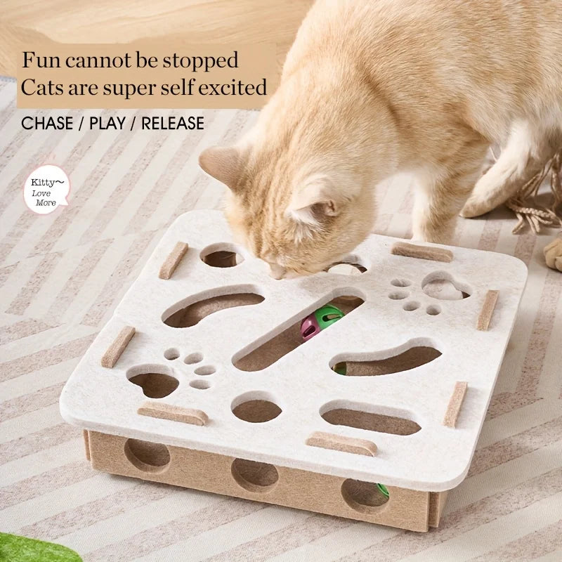 Cat playing with a interactive cat toy on a striped surface