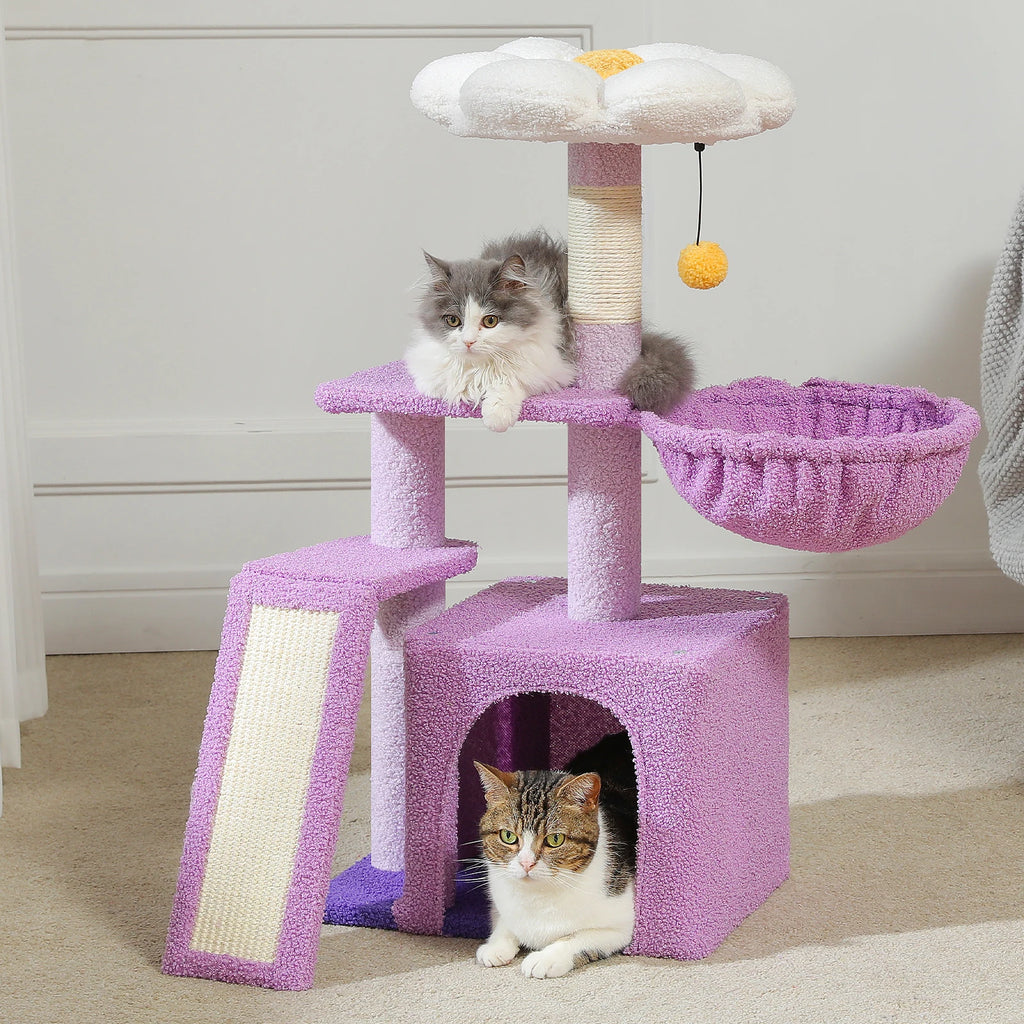 Pink cat tree with two cats on a light-colored floor.