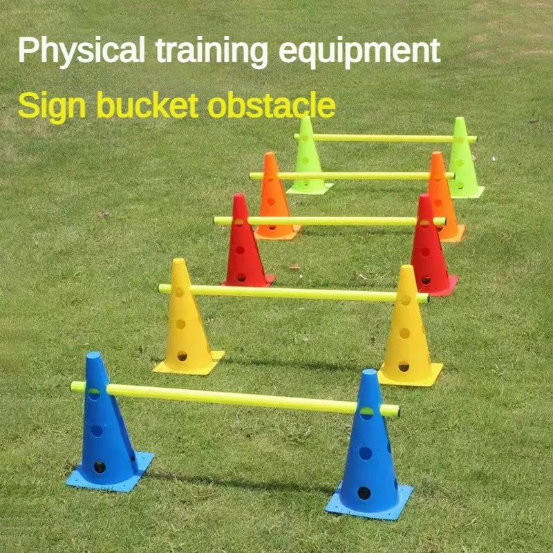 Colorful physical training equipment with sign bucket obstacles on grass